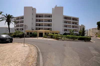 a car parked in front of a building at Marbel Sol Apartment Al in Quarteira