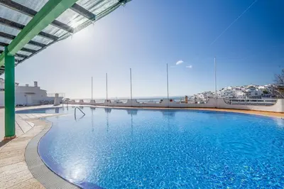 a large swimming pool on the roof of a building at Prestige Flat by Albufeira Holidays in Albufeira