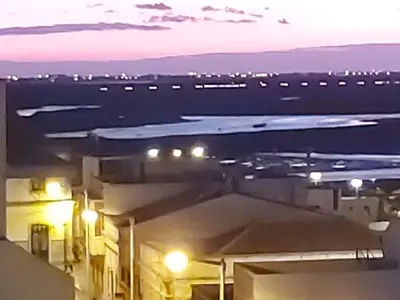 a view of a city at night with street lights at Faro Charm Apartment - City Center in Faro