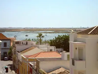 a view of a river from a city with buildings at Faro Charm Apartment - City Center in Faro
