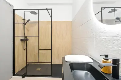 a bathroom with a shower and a sink at Sea Side in Albufeira