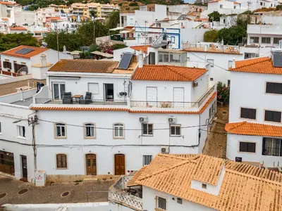 an aerial view of white houses with orange roofs at Sea Side in Albufeira