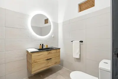 a bathroom with a sink and a mirror at Sea Side in Albufeira