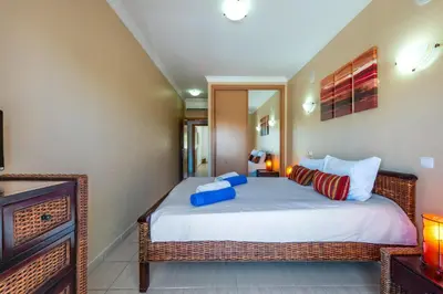a bedroom with a large bed in a room at Encosta Sao Jose - Apartment V in Albufeira