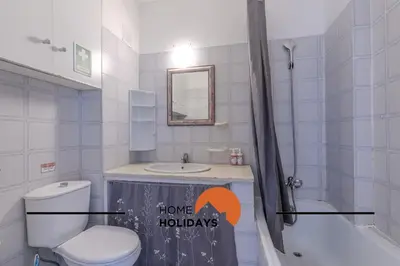 a bathroom with a toilet and a sink and a shower at #295 Beco do Sol 29A by Home Holidays in Albufeira