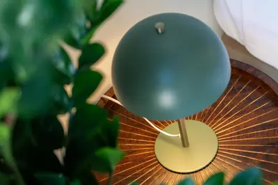 a blue balloon sitting on top of a wooden table at The 23 Suites in Faro