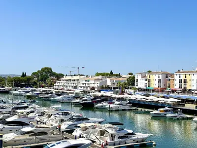 a bunch of boats docked in a harbor with buildings at Vilamoura Marina View 4 by Homing in Vilamoura