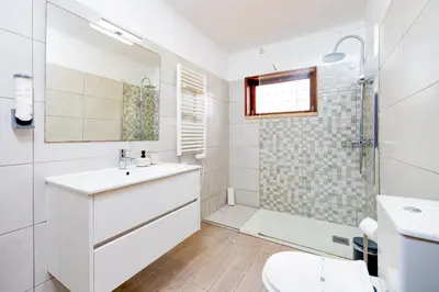 a bathroom with a sink and a tub at Casa Gralheira - Private Pool & Sea View in Albufeira