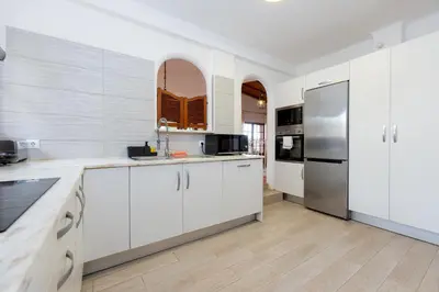 a kitchen with a sink and a counter top at Casa Gralheira - Private Pool & Sea View in Albufeira