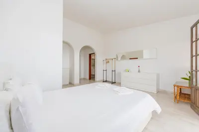a room with a balcony with a table and a view at Casa Gralheira - Private Pool & Sea View in Albufeira