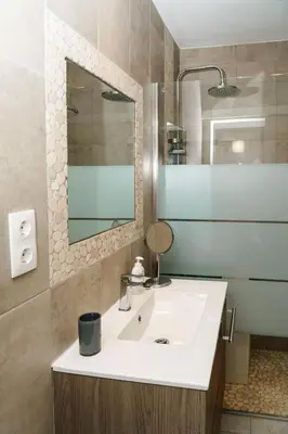 a bathroom with a white sink and a mirror at Apartment Maresias 120 m Oura Beach By Bedzy in Albufeira