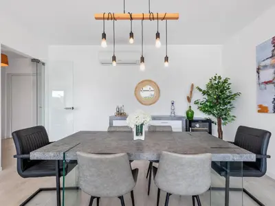 a dining room with a table and chairs at Villa Linda V3 Lote 67 - VIP Properties by Interhome in Albufeira