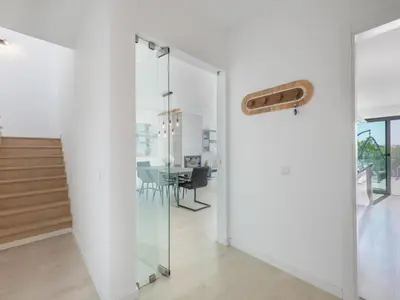 a dining room and living room with a table and chairs at Villa Linda V3 Lote 67 - VIP Properties by Interhome in Albufeira