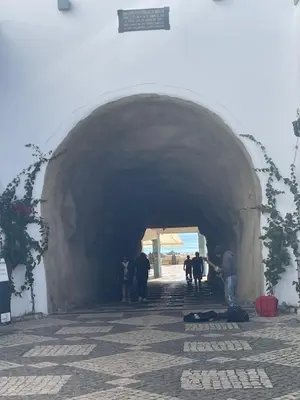 a group of people walking through a tunnel at Casa Tapada do Bento III- Albufeira in Albufeira