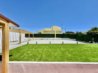 a large yard with a green lawn at Almancil Typical House by Homing in Almancil