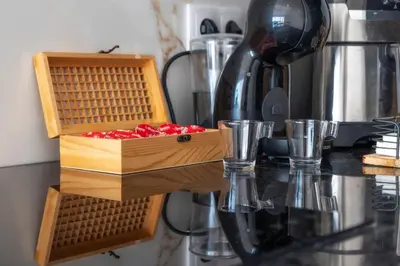a wooden box on top of a counter with cups at LuxPool Albufeira Stay in Albufeira