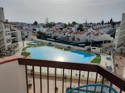 a view of a pool from the balcony of a apartment at Sunset in Albufeira