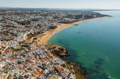 an aerial view of a beach with buildings and the ocean at Baleeira Sea View Studio in Albufeira
