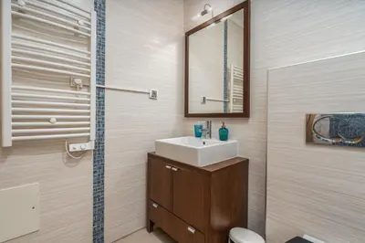 a bathroom with a sink and a mirror at Casa Vista Brejos in Albufeira