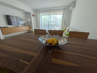 a bowl of fruit on a table in a living room at Solar dos Pinheiros T3 in Vilamoura
