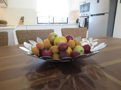 a bowl of fruit sitting on a table at Solar dos Pinheiros T3 in Vilamoura