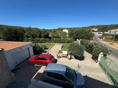 a red car parked on the roof of a house at Maison entière 10-12 personnes à Goldra de çima Loulé in Loulé
