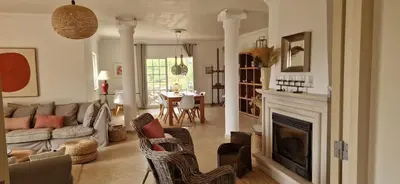 a living room with a couch and a fireplace at Casa Amani in Loulé