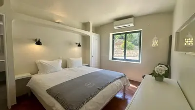 a bedroom with a large bed and a window at Tropicana by Check-in Portugal in Albufeira