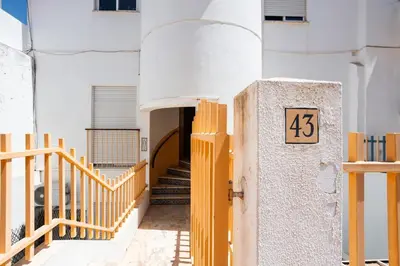 an entrance to a building with a number on it at Gorgeous Flat 3min Walk to Beach in Albufeira