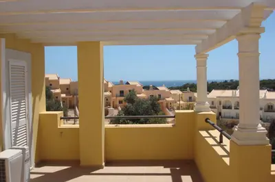 a balcony with a view of the city at Albufeira Luxury Villa in Albufeira