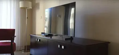 a dresser with a large mirror in a room at VILAMOURA - The Residences in Quarteira