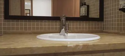a sink with a faucet in a bathroom at VILAMOURA - The Residences in Quarteira