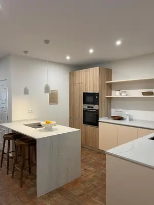 a kitchen with white counters and a white counter top at Vila Antic in Almancil