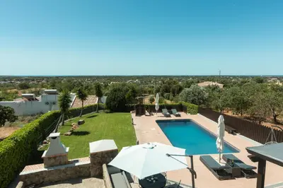 a villa with a swimming pool and a view at Casa Do Vale - Algarve in Vargem da Mão