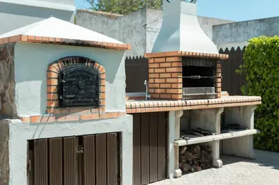 a pizza oven sitting on top of a patio at Casa Do Vale - Algarve in Vargem da Mão