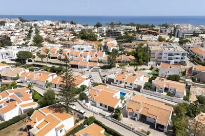 an aerial view of a city with houses at Vila Coelho - City center with pool by HD in Vale de Pedras