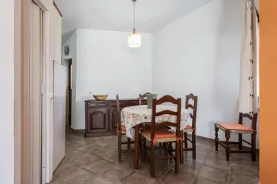 a dining room with a table and chairs at Vila Coelho - City center with pool by HD in Vale de Pedras