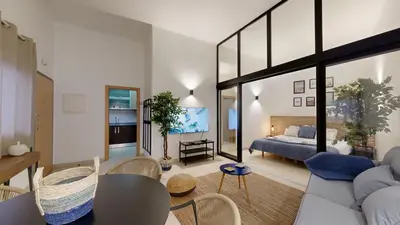 a living room with a couch and a bed at Apartamento T0 MFA, 400m Praia dos Pescadores in Albufeira