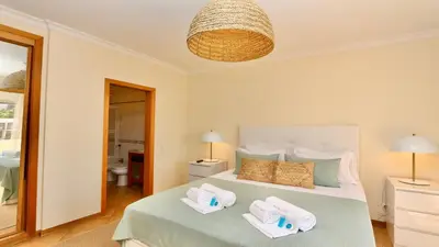 a bedroom with a bed with two towels on it at Marina Sol - CD 308, Cleverdetails - great location in Vilamoura
