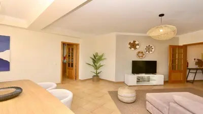 a living room with a couch and a television at Marina Sol - CD 308, Cleverdetails - great location in Vilamoura