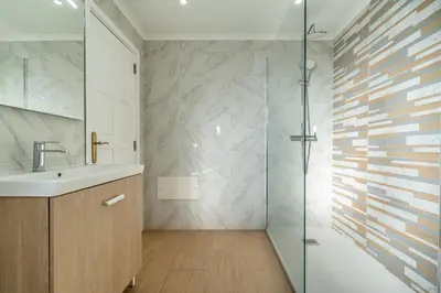 a bathroom with a sink and a shower at Pet-Friendly with Private Pool Close to the Beach in Galé