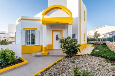 a house with a yellow and white facade at Pet-Friendly with Private Pool Close to the Beach in Galé
