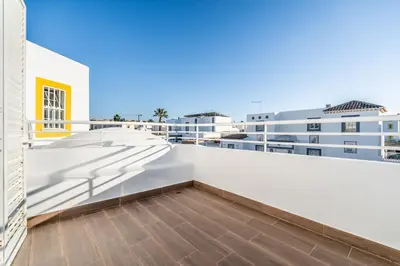 a balcony with white walls and a wooden floor at Pet-Friendly with Private Pool Close to the Beach in Galé