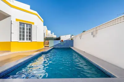a swimming pool in the middle of a building at Pet-Friendly with Private Pool Close to the Beach in Galé