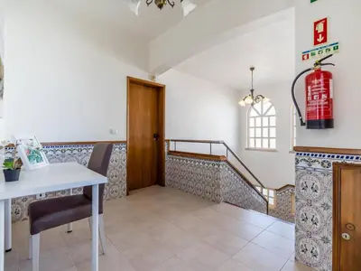 a room with a table and a fire hydrant at Villa Paradis Paraiso com piscina privada em Albufeira in Albufeira
