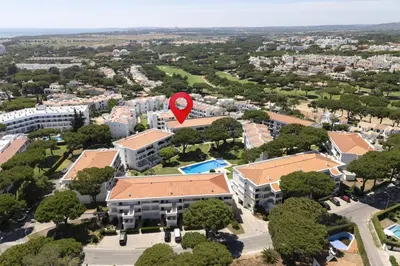 an aerial view of a campus with a red marker at NEW! Vilamoura Garden View in Quarteira