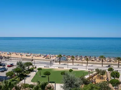 a view of the beach and the ocean at T1 com Varanda e vista mar a 200m da Praia in Quarteira
