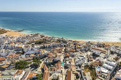 an aerial view of a city and the ocean at Downtown 1 Bedroom Apartment E - 150m from the Beach in Albufeira