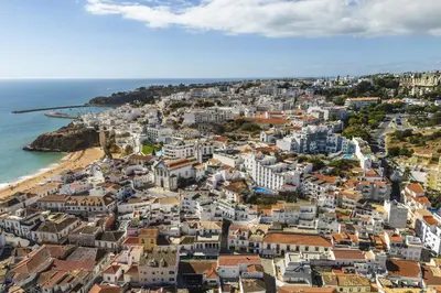 an aerial view of a city and the ocean at Downtown Studio Apartment G - 150m from the Beach in Albufeira