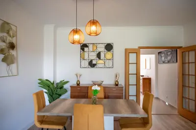 a dining room with a table and chairs at Sunset Villa No 19 in Galé